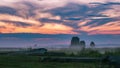 Evening mist over the Podlasie meadow. Beautiful sunset. Royalty Free Stock Photo