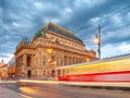 Evening at National Theater and blurred tram on the bridge, Prague, Czech Republic. Long exposure shot Royalty Free Stock Photo