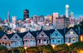 Evening, Painted Ladies Victorian houses in Alamo Square and a view of the San Francisco skyline and skyscrapers. Photo Royalty Free Stock Photo