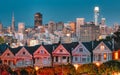 Evening, Painted Ladies Victorian houses in Alamo Square and a view of the San Francisco skyline and skyscrapers. Photo Royalty Free Stock Photo