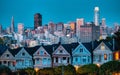 Evening, Painted Ladies Victorian houses in Alamo Square and a view of the San Francisco skyline and skyscrapers. Photo Royalty Free Stock Photo