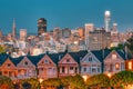 Evening, Painted Ladies Victorian houses in Alamo Square and a view of the San Francisco skyline and skyscrapers. Photo Royalty Free Stock Photo