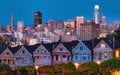 Evening, Painted Ladies Victorian houses in Alamo Square and a view of the San Francisco skyline and skyscrapers. Photo Royalty Free Stock Photo