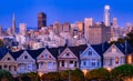 Evening, Painted Ladies Victorian houses in Alamo Square and a view of the San Francisco skyline and skyscrapers. Photo Royalty Free Stock Photo