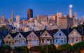 Evening, Painted Ladies Victorian houses in Alamo Square and a view of the San Francisco skyline and skyscrapers. Photo Royalty Free Stock Photo