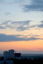 Evening panorama of the city of Togliatti overlooking residential areas, a brick house under construction and a tower crane. Royalty Free Stock Photo