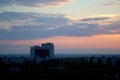 Evening panorama of the city of Togliatti overlooking residential areas, a brick house under construction and a tower crane. Royalty Free Stock Photo