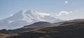 Evening panorama of Mount Elbrus from two peaks with snow and glaciers