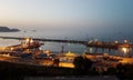 Evening panorama of the port of Skikda and the calm expanse of the Mediterranean Sea after sunset. Algeria. April 27, 2018