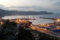 Evening panorama of the port of Skikda and the calm expanse of the Mediterranean Sea after sunset. Algeria April 27, 2018