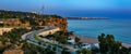 Evening panoramic view of Antalya coastline with road, beach and coastal cliffs
