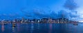 Evening panoramic view of the lighted Victoria Harbour in HK Royalty Free Stock Photo
