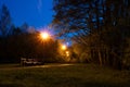 Evening park, alley lit by lanterns Royalty Free Stock Photo