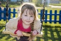 In the evening in the park on the playground girl riding on a sw Royalty Free Stock Photo