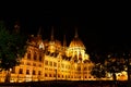 Evening photo of the Parliament building in Budapest.The majestic Saxon architecture is illuminated with warm yellow light Royalty Free Stock Photo