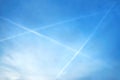 Evening picture of blue sky with white triangle creating three planes over the Krusne hory Mountains in northern Bohemia