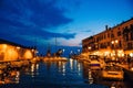 Evening pier on Lake Garda, evening promenade in the old town, yachts on the pier in Italy, Royalty Free Stock Photo