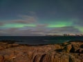 Evening polar landscape with the Aurora Borealis