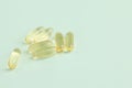 Evening primrose oil capsules on blue background Royalty Free Stock Photo