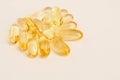 Evening primrose oil capsules on pink background Royalty Free Stock Photo