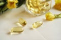Evening primrose oil capsules on a white table Royalty Free Stock Photo