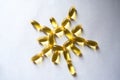 Evening primrose oil supplement softgels in a sun shape from above