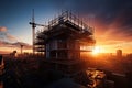 Evening progress Building under construction silhouetted against the sunset Royalty Free Stock Photo