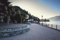 Evening promenade near Como lake coastline at Mennagio town, Italy