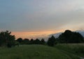 Evening rural landscape. Dirt road among trees. Royalty Free Stock Photo