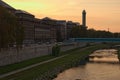 Evening scenery of Ostrava city. Ostravice river, embankment and bridge over river, residential buildings and New Town Hall
