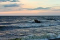 Evening on the sea, dark, a boat, few men three Royalty Free Stock Photo