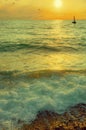 Evening sea, light waves of water, a sailboat on the horizon Royalty Free Stock Photo