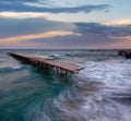 Evening sea storm and ruined pier (Black Sea, Bulgaria Royalty Free Stock Photo