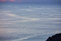 Evening seascape idea. Yacht float in ocean and calm deep sea. Nature landscape and water texture concept, copy space