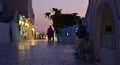 Evening shopping in the village of Oia Santorini Greece with shop lights and reflections. Royalty Free Stock Photo