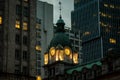 An evening shot of a clocktower from an old building in downtown Vancouver British Columbia