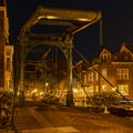 Evening shot of an old bridge The Kerkbrug on the Old Rhine river, with in the background the beautiful Hooglandse Kerkgracht, L Royalty Free Stock Photo