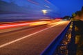 Evening shot of trucks doing transportation and logistics on a highway. Highway traffic - motion blurred truck on a highway motorw