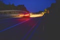 Evening shot of trucks doing transportation and logistics on a highway. Highway traffic - motion blurred truck on a highway motorw