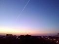 Evening sky with aircraft trail