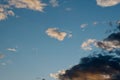 Evening sky background with grey cirrus clouds. Low beams with warm yellow light Royalty Free Stock Photo