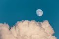 Evening sky with clouds and bright partial moon. Nightsky with large moon, nature background