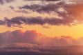 Evening sky with cumulus clouds in warm sunset colors Royalty Free Stock Photo