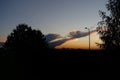 Evening sky with exceptionally beautiful clouds colored in shades of orange.