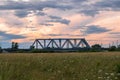 Evening sky over the railway bridge and flowered Bogolyubovo meadow, Vladimir region. Royalty Free Stock Photo