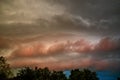 Evening sky with red clouds before a summer storm. Russia, Kostroma.