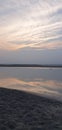 Evening Sky With Sand and Water Colours of sunset Royalty Free Stock Photo