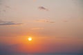 Evening sky with the setting sun over the sea