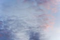 Evening sky with some pink and dark clouds - blue hour background