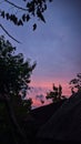 evening sky with the sun setting over the house Royalty Free Stock Photo
